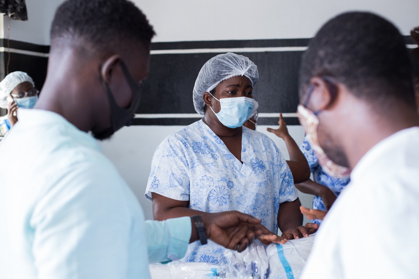 Healthcare worker receiving donated medical supplies during community outreach