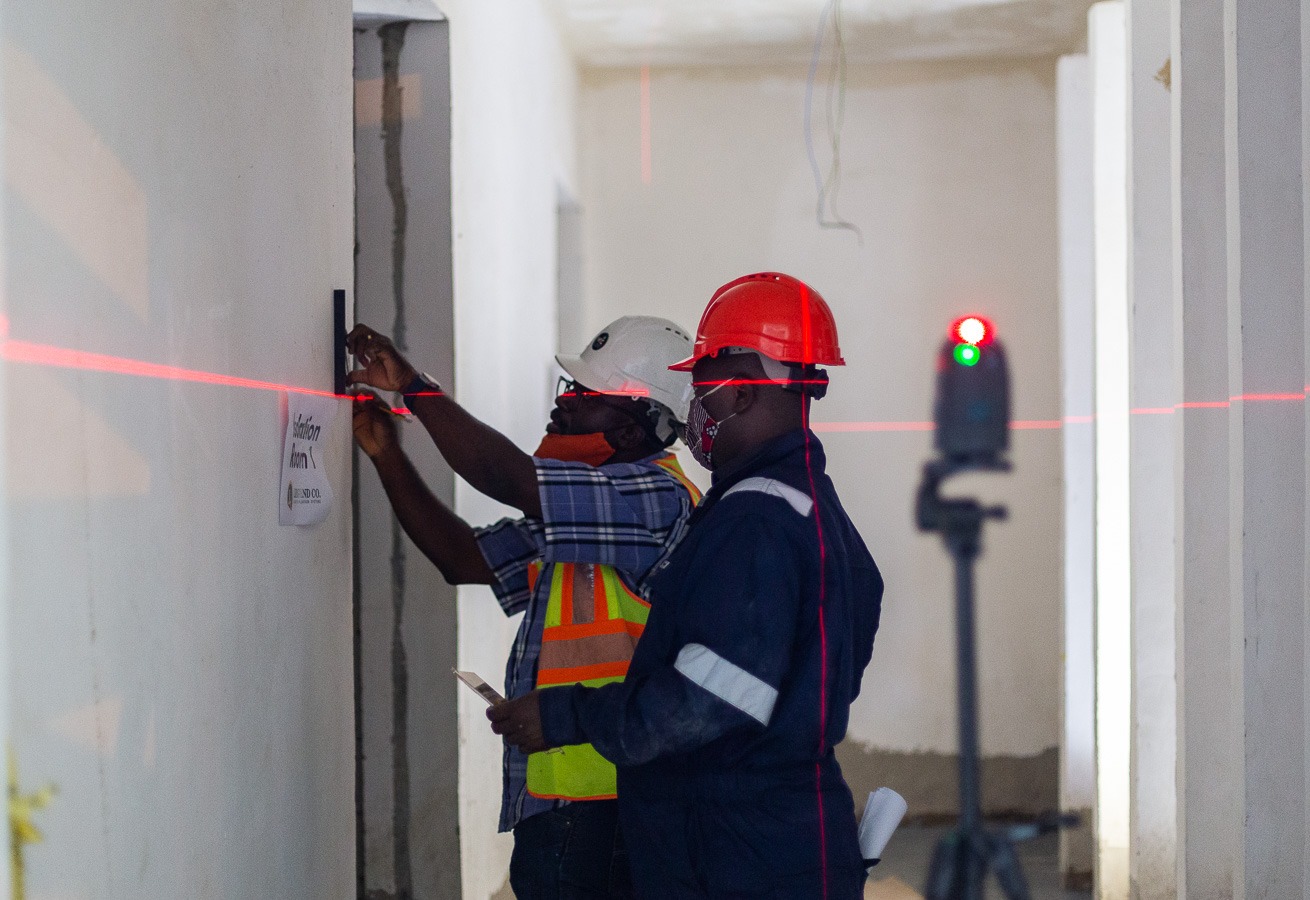 Calibrated tools ensuring millimeter-accurate signage placement